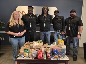DataBank Houston employees with food drive donations
