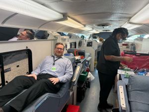 DataBank employee giving blood in mobile truck