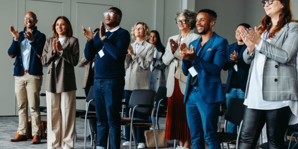 Employees celebrating a workplace recognition award