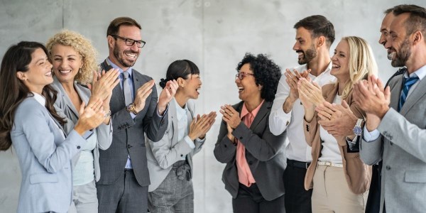 Employees applauding at a company recognition event
